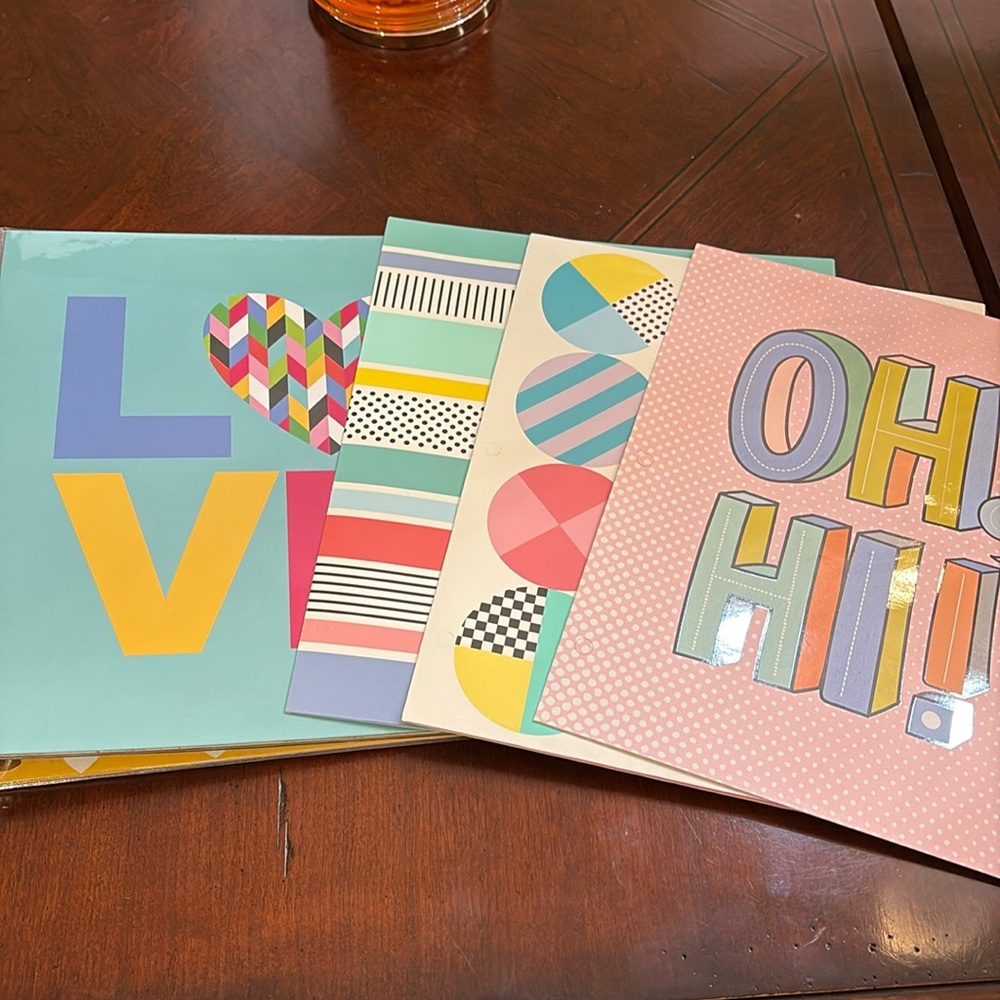 Set of one 1” binder and three two-pocket patterned folders. Studio C.